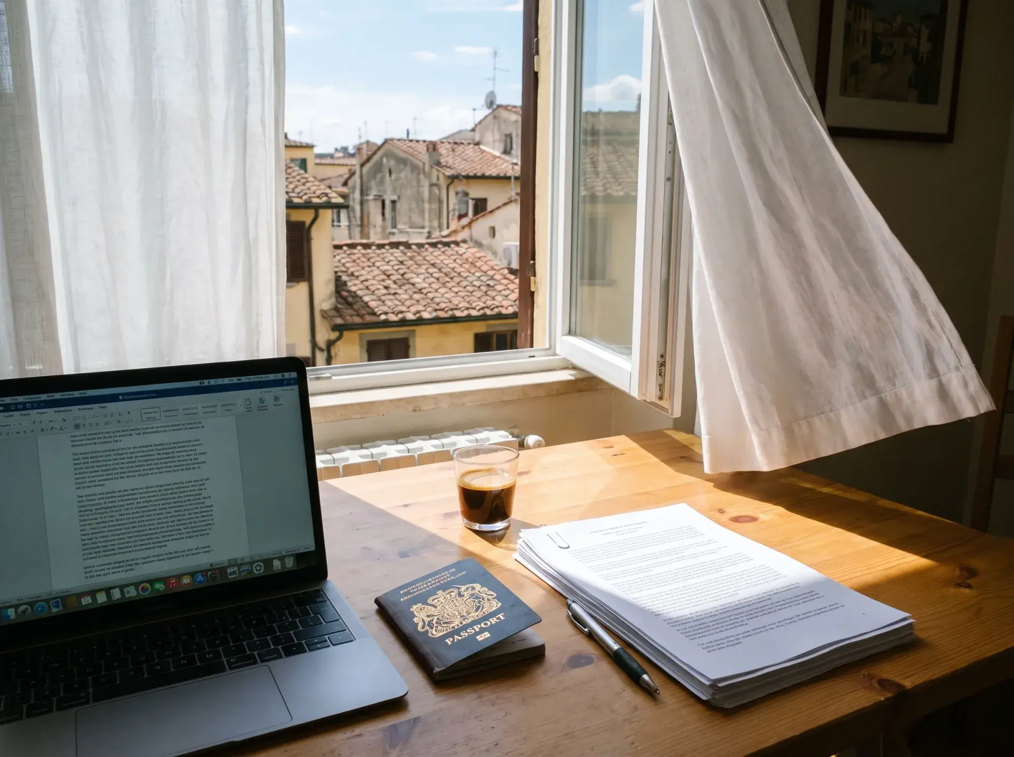 Illustrative image: laptop, passport and printed documents on a sunlit table